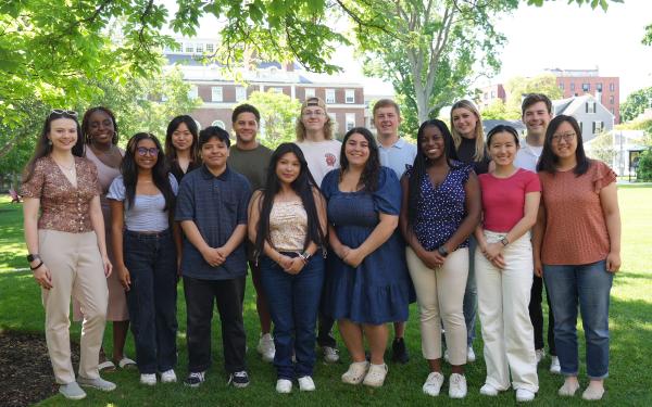 Student Interns posed on the grass of Radcliffe Institute.
