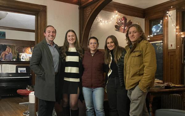 Quinn posing for a group photo with his friends during Thanksgiving