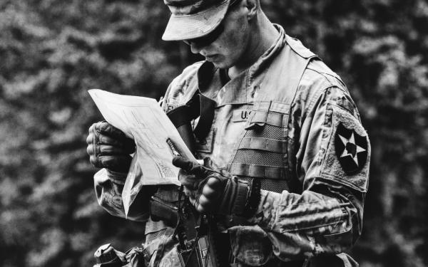 Soldier analyzes paper