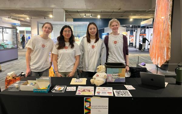 4 researchers at Harvard LDS at a participant recruitment event at the Museum of Science!