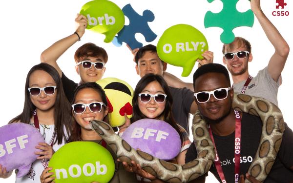 Photo booth photo of Inno and other staff cohort members at the fall 2022 Puzzle Day.