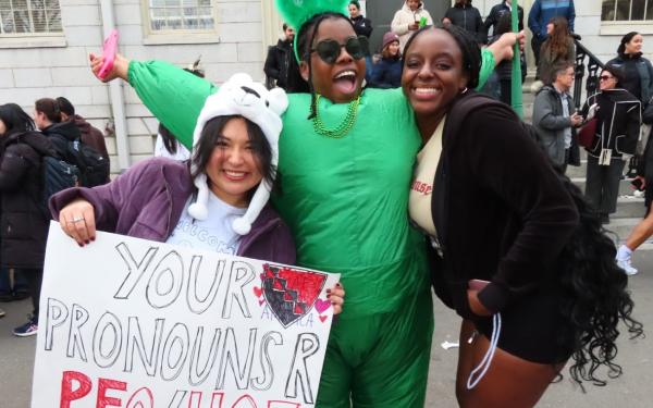 3 girls happily posing in Harvard Yard during Housing Day 2025. 