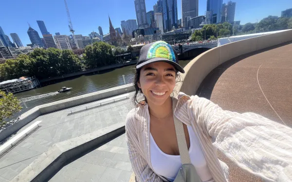 A smiling selfie on a sunny day with the Melbourne city skyline in the back