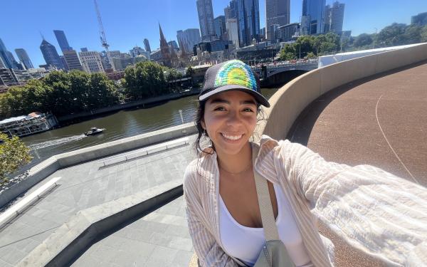 A smiling selfie on a sunny day with the Melbourne city skyline in the back