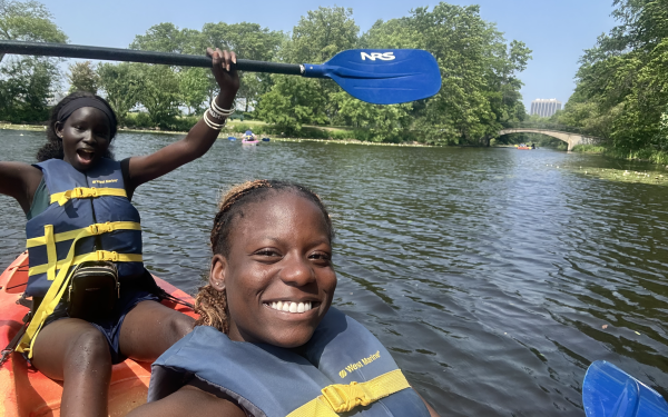 My co-worker Nyankiir and I kayak down the Charles River.