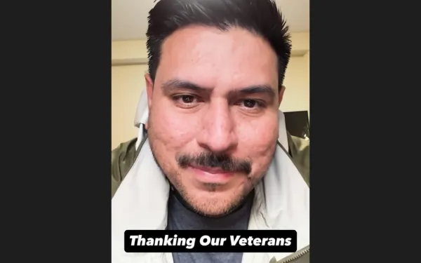Man smiling with text "Thanking Our Veterans"