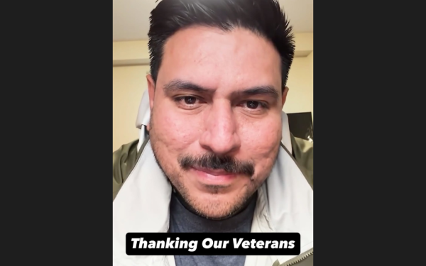 Man smiling with text "Thanking Our Veterans"