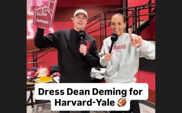Two people in Harvard gear holding microphones and foam finger, promoting Harvard-Yale game.