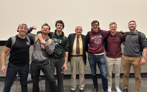 Veterans at Harvard College stand with Professor Gregory Nagy after class