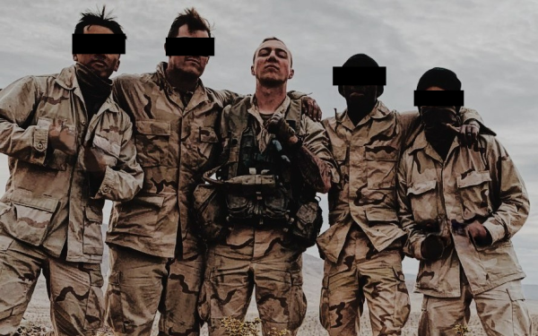 A group of soldiers pose for a picture during a training exercise