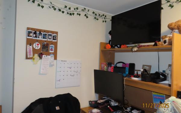 A desk set-up with a monitor and TV. 