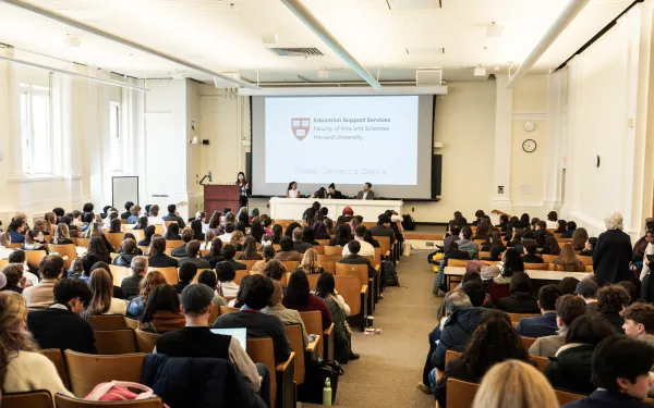 Students seated in large full lecture hall 