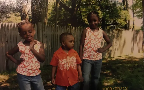 My siblings and I in matching Hawaiian Print outfits