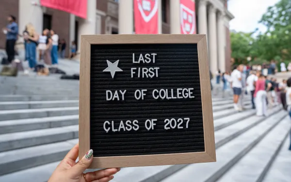 A letter board stating "Last First Day of College Class of 2027." 