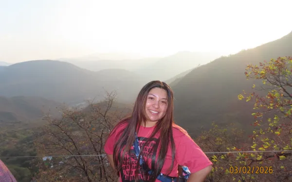 Daisy in front of mountain ranges. 