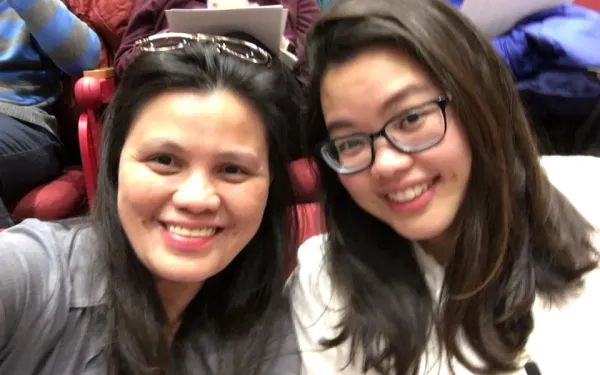 student and parent in a lecture hall