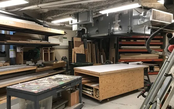 The scene shop, with tables and saws and wood set up for set building