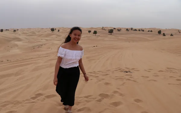 Student walking in dessert