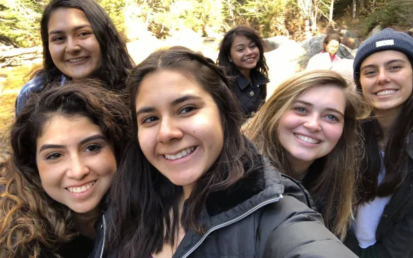 A picture of author with other LU board members near a hiking trail