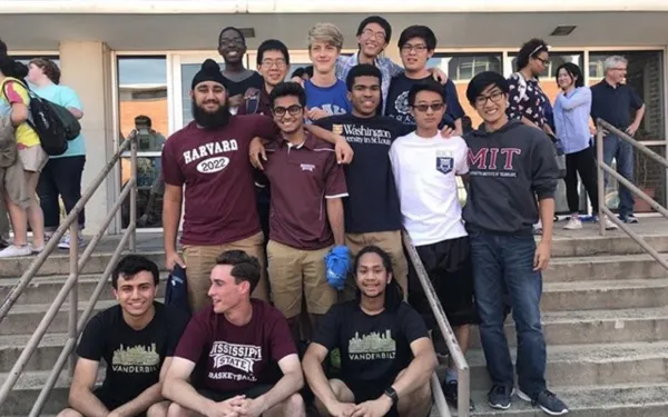 Harpreet and his high school friends posing on College Reveal Day!
